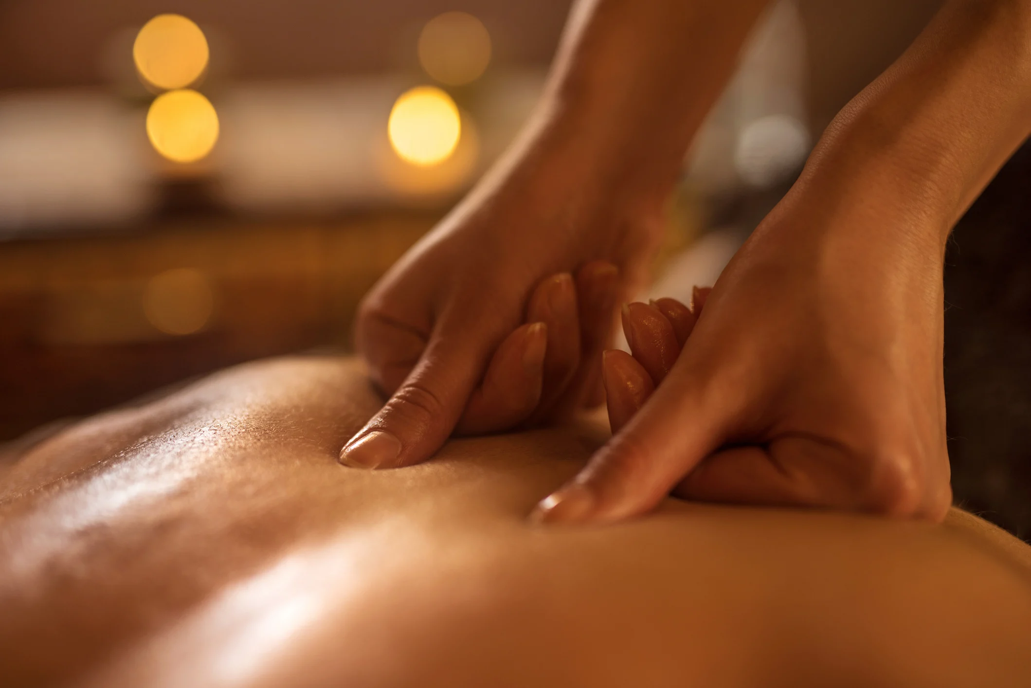 close-up of massage therapy on male customer at spa